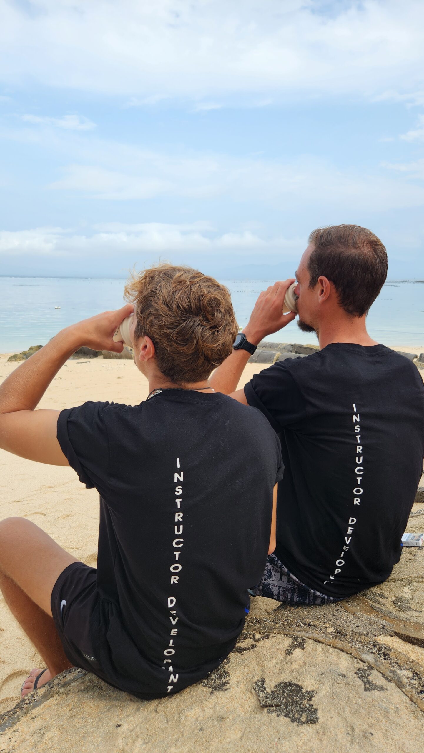 Instructor-Development-dive-career-Nusa-lembongan IDC Candidates of Scuba Center Asia sip coffee on the beach in the morning before their Instructor Exam, ready and focused for the day ahead.